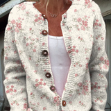 Rosa koftblus med rosmönster och knappar