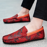 Loafers i läder med blomdetalj