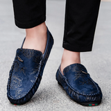 Loafers i läder med blomdetalj