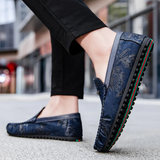 Loafers i läder med blomdetalj