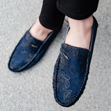 Loafers i läder med blomdetalj