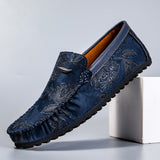 Loafers i läder med blomdetalj