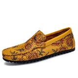 Loafers i läder med blomdetalj