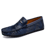 Loafers i läder med blomdetalj