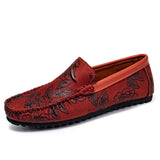 Loafers i läder med blomdetalj