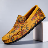 Loafers i läder med blomdetalj