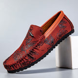 Loafers i läder med blomdetalj