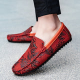 Loafers i läder med blomdetalj